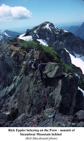 Rick Eppler belaying on the Prow - summit of Steamboat Mountain behind