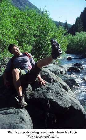 Rick Eppler draining creekwater from his boot